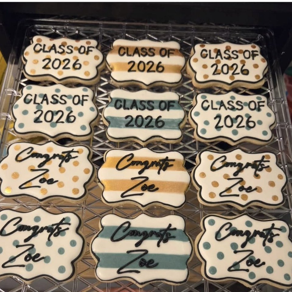 A tray of Class of 2026 and Congrats Zoe graduation cookies